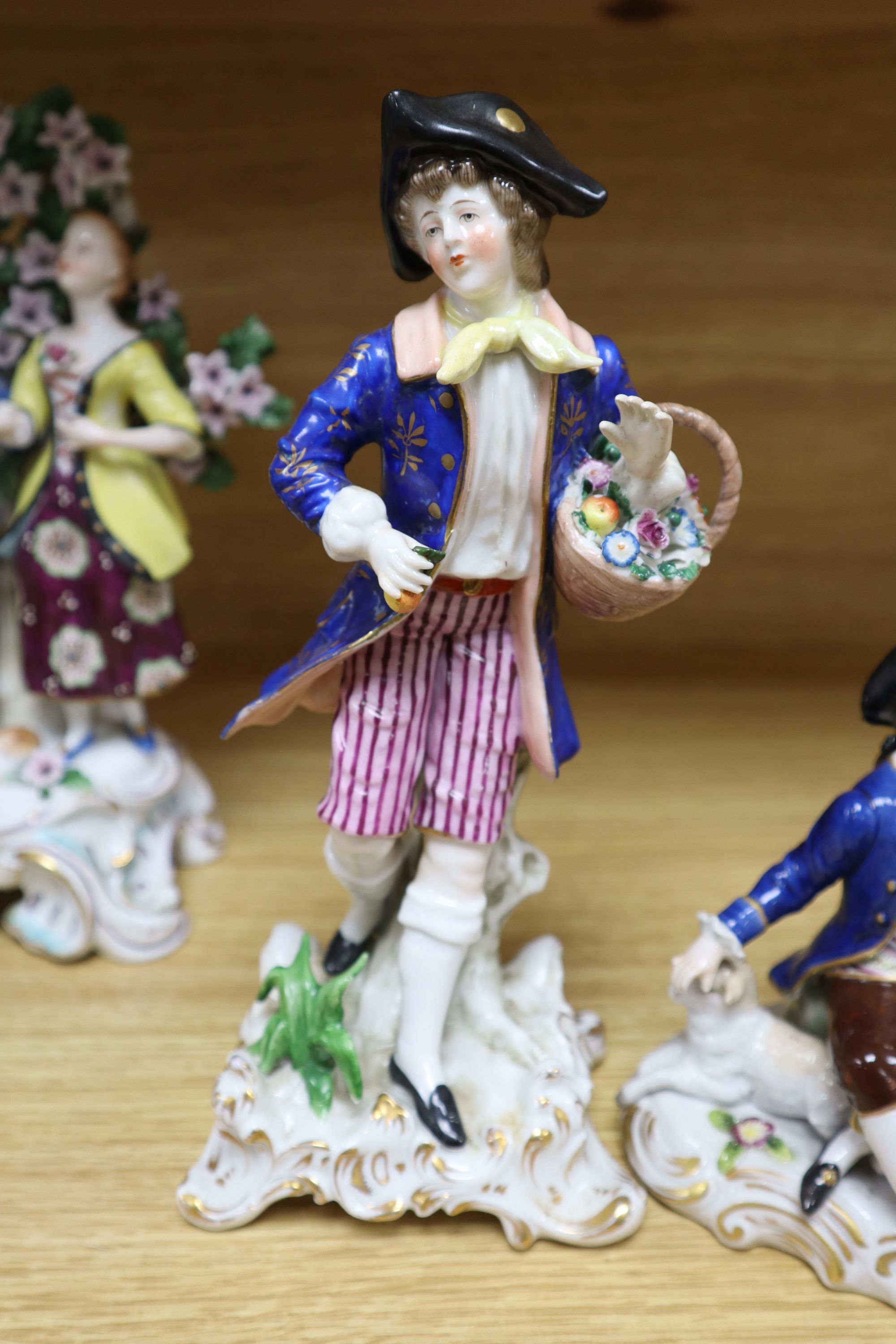 A Hochst porcelain shepherd and shepherdess group and four other modern Continental figures